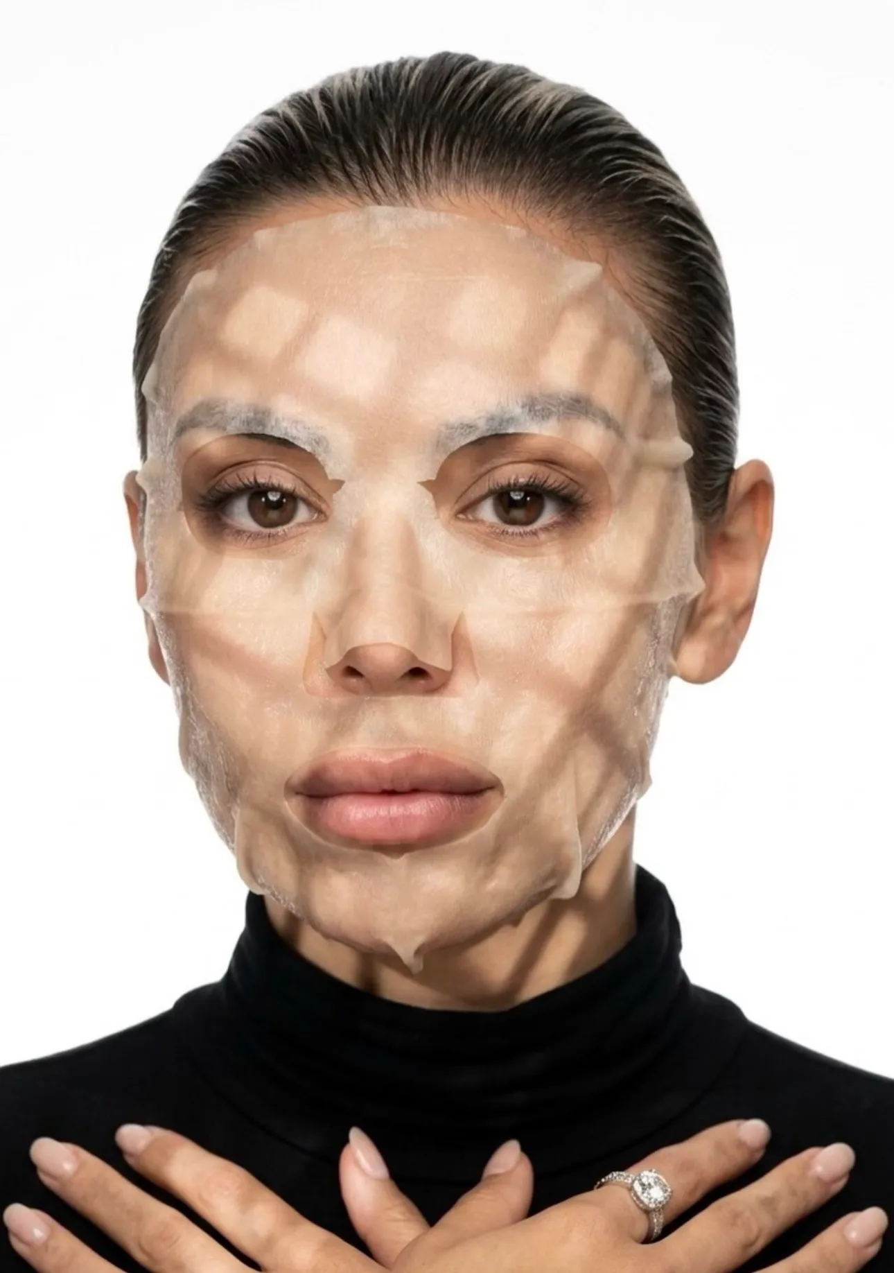 A client wearing a sheet mask during a face treatment